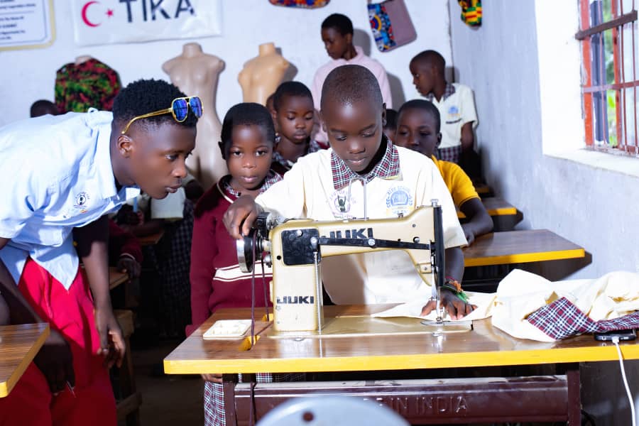Students learning sewing skills