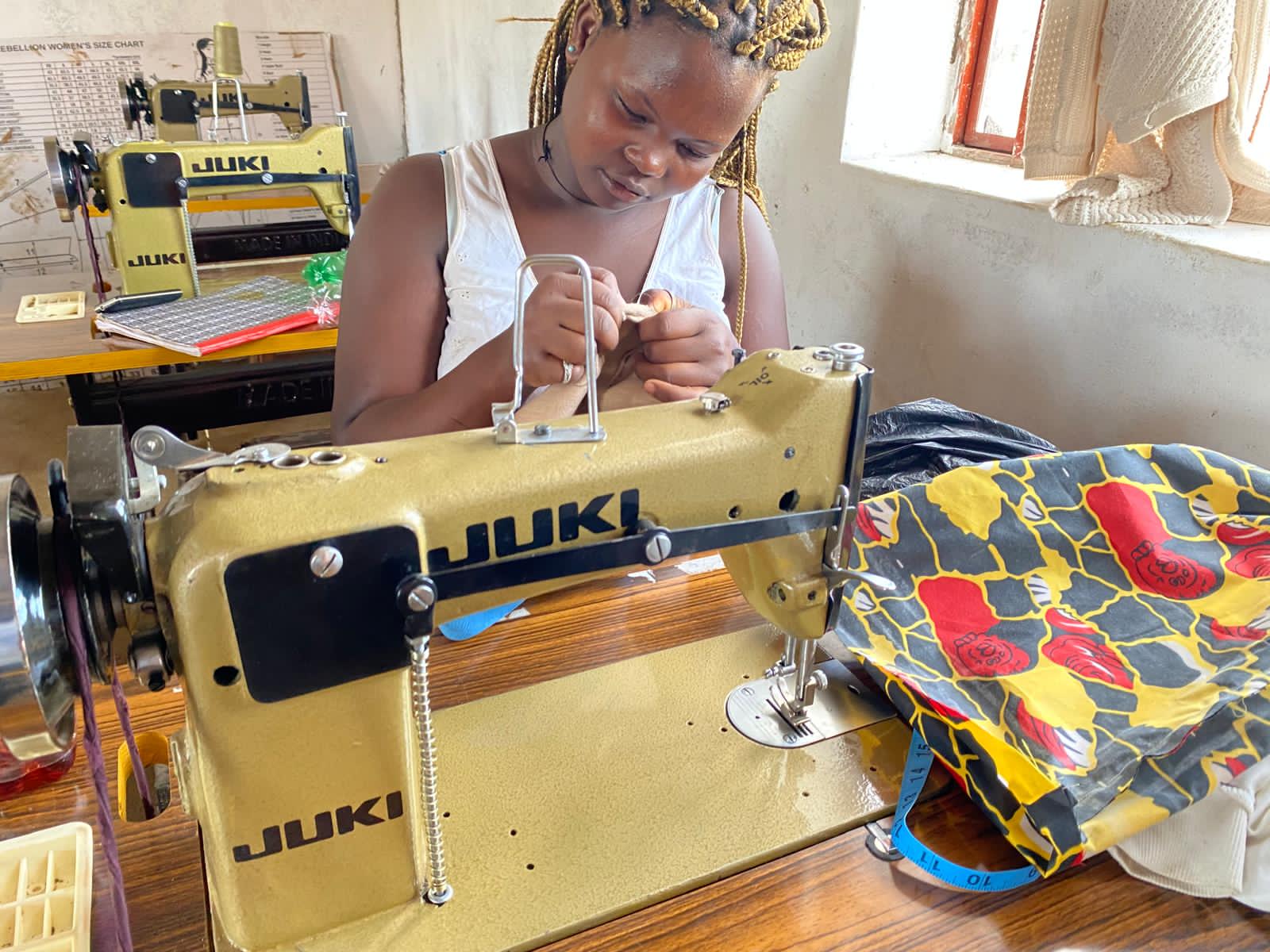 Adult student at sewing machine